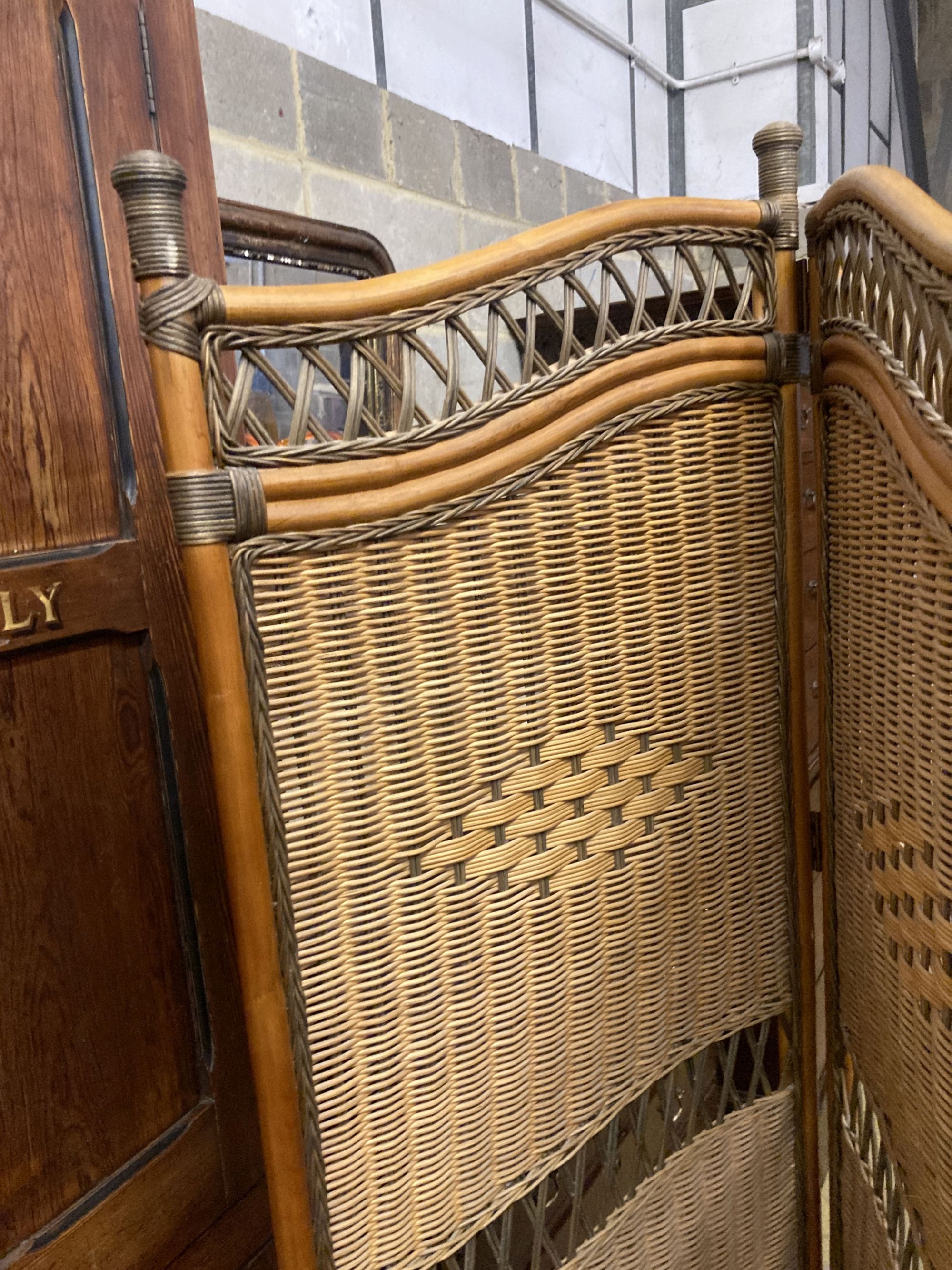 A three fold bamboo and rattan dressing screen, height 186cm